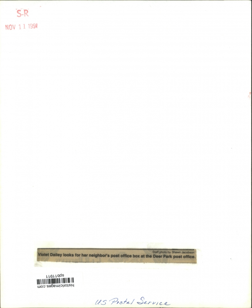 1991 Violet Dailey looks for post office box, Deer Park Post Office Historic Images